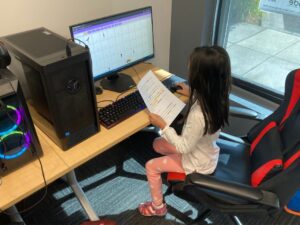 Student learning Scratch programming in Jr Programmer Camp