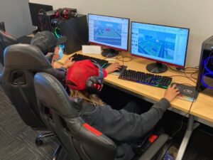 Students coding in iCode's Roblox Editor Course