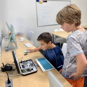 Two students working on a Raspberry Pi