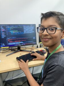 a child in front of his coding project!