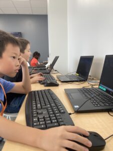 child focusing on his code project