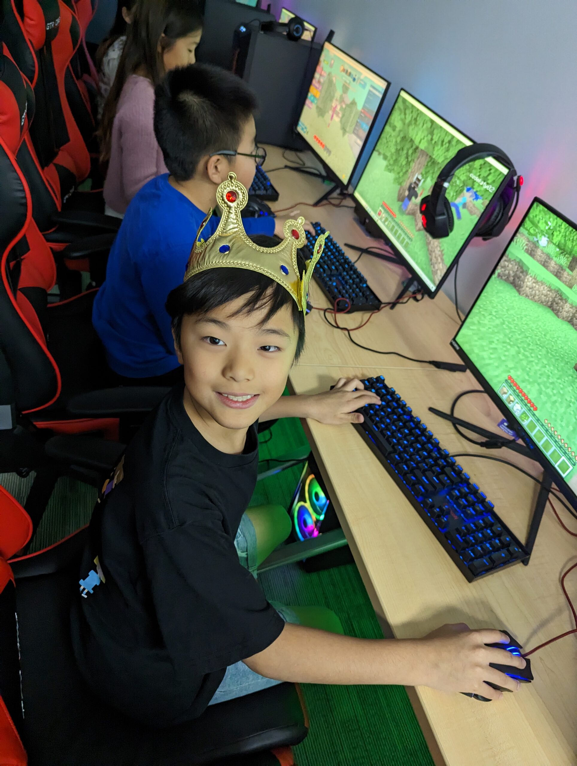 A boy plays games at his iCode Gaming themed Birthday Party