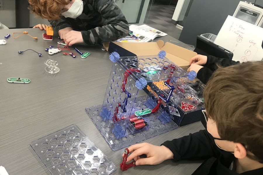Students building electronic circuits