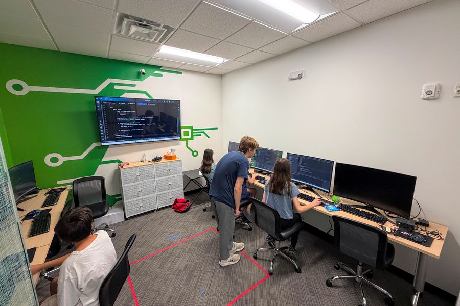 Students working on code in an instructor-led class