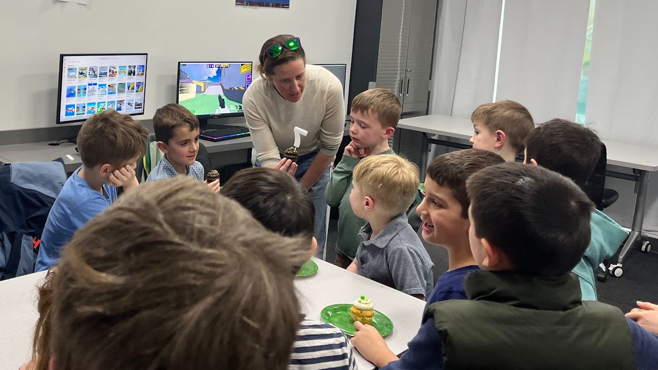 An iCode instructor with a small group of students