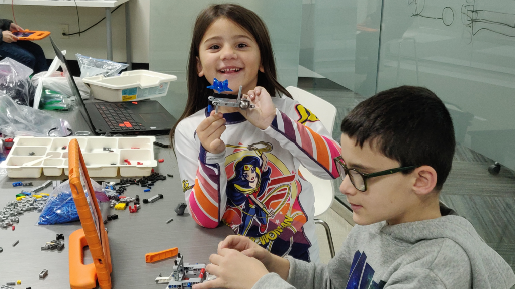 STEM Education - Kids working on a robot design at iCode school classroom